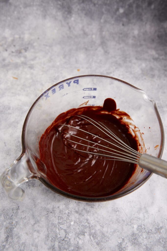 A bowl of melted chocolate and butter.