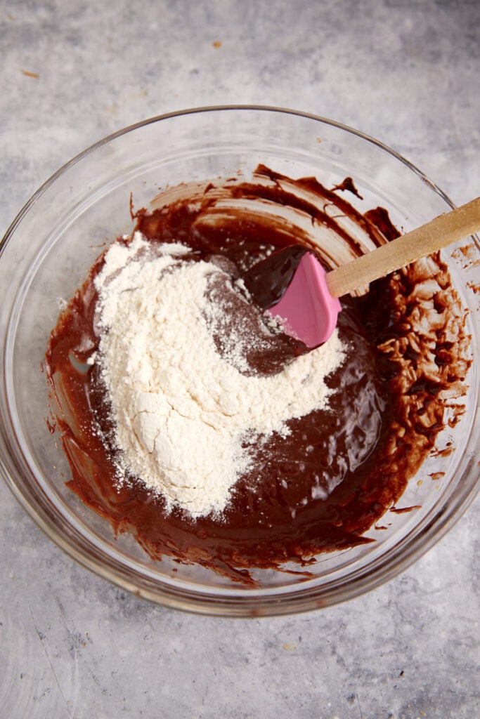 Flour being folded into the cookie batter.
