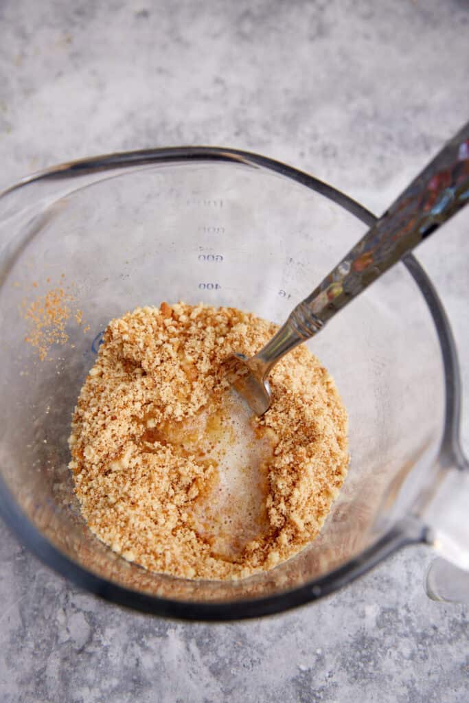 Butter added to crushed vanilla wafers.