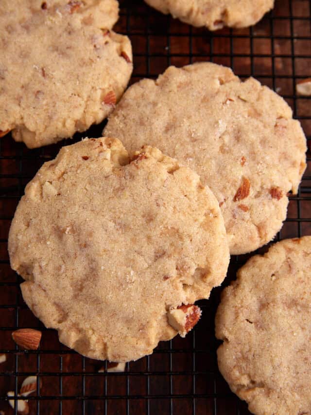 Two baked almond sugar cookies.