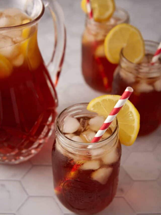 A pitcher and three glasses of sweet tea.