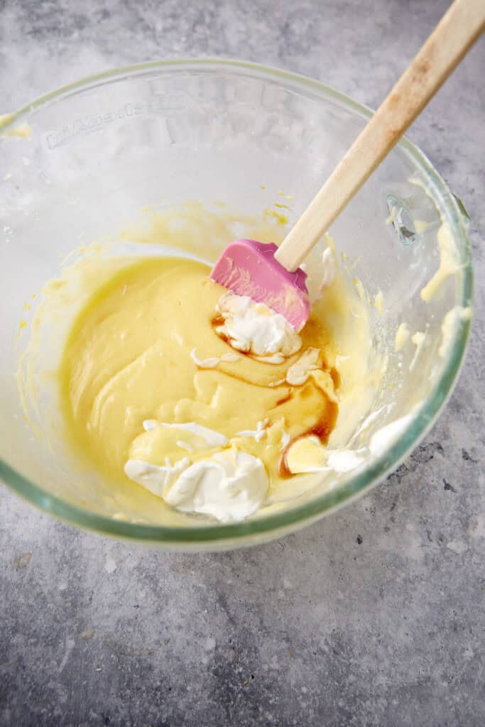 Vanilla and sour cream added to cake batter.