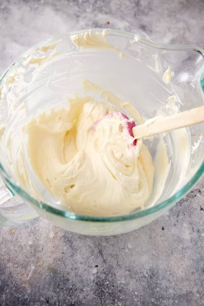 Cream cheese frosting mixed in a bowl.
