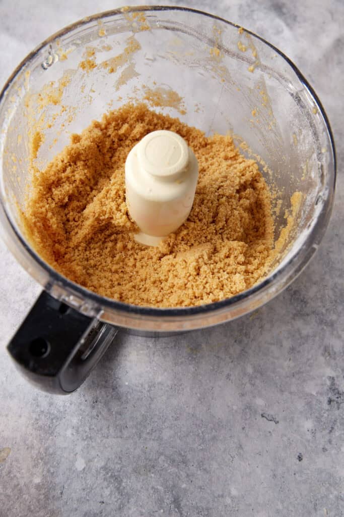 Graham crackers and butter in a food processor.