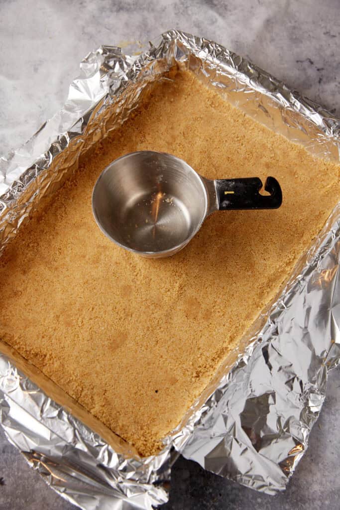 Crust tapped into a baking pan.