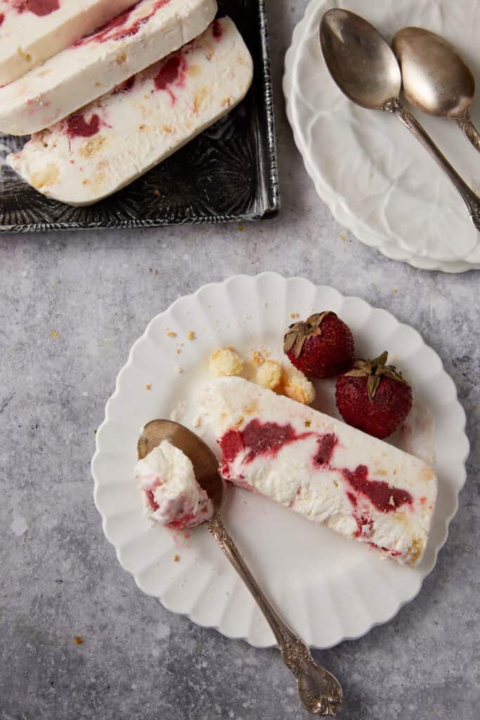 A single slice of frozen strawberry trifle.