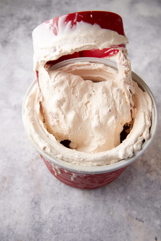Strawberry ice cream in an ice cream maker.
