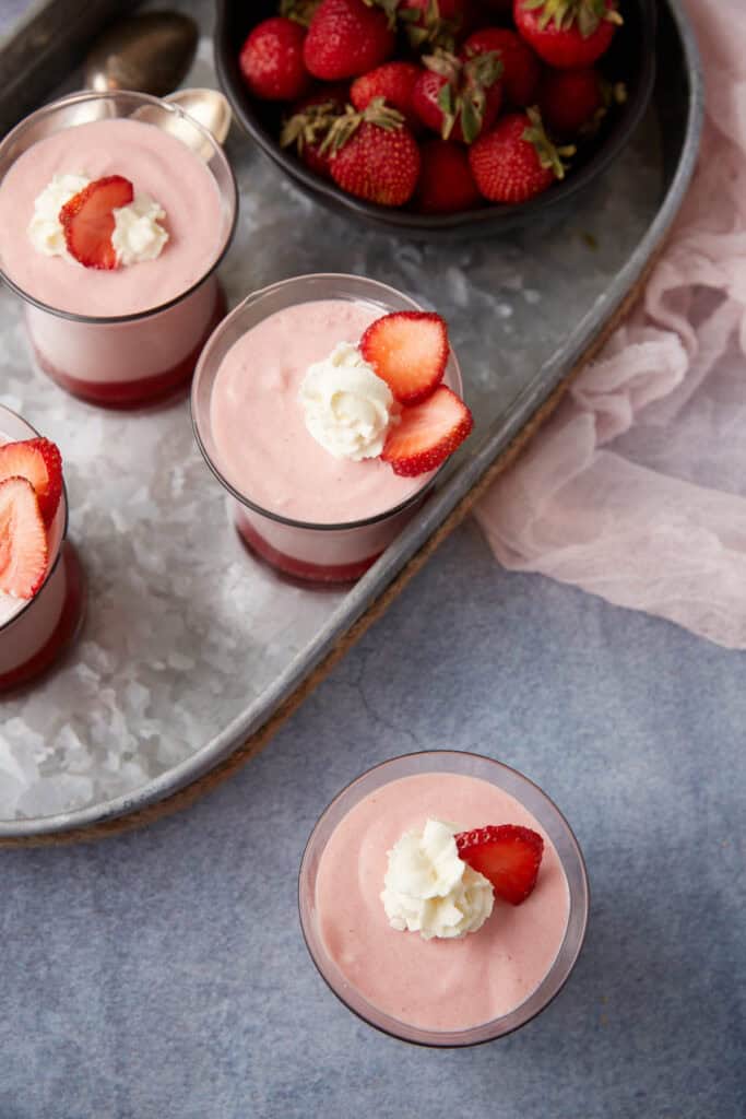 Four servings of white chocolate strawberry mousse.