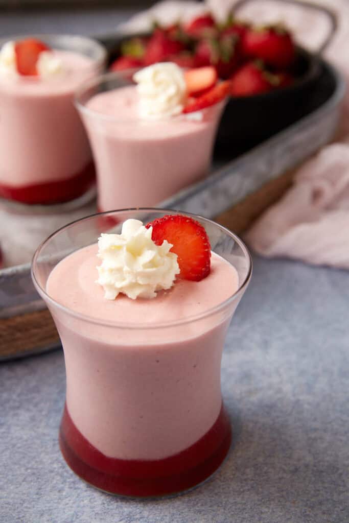 Three servings of strawberry white choocolate mousse.