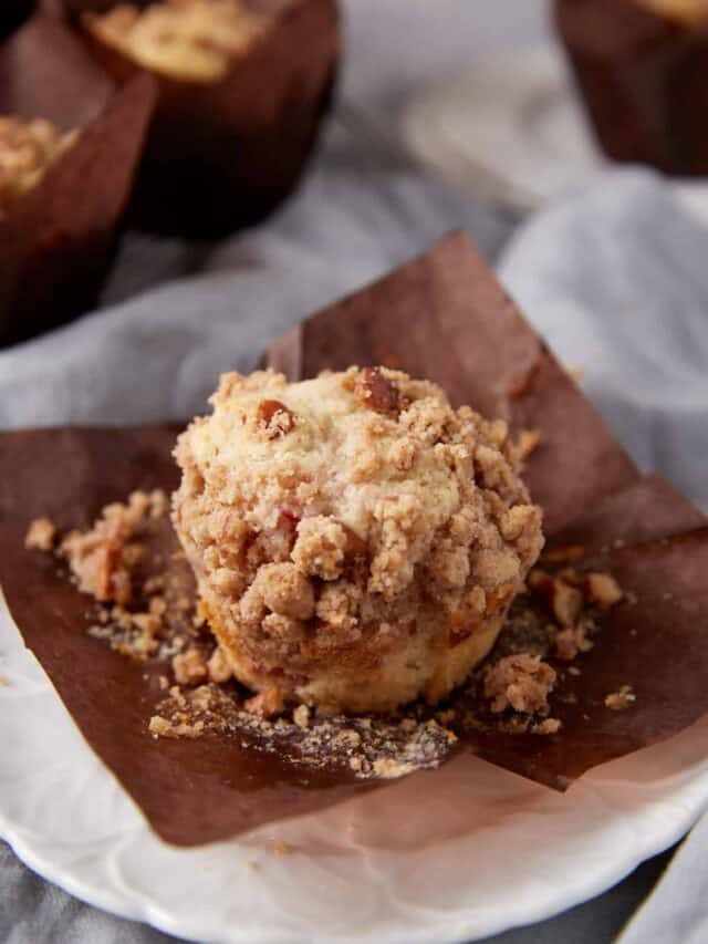 A single rhubarb streusel muffin with sour cream.
