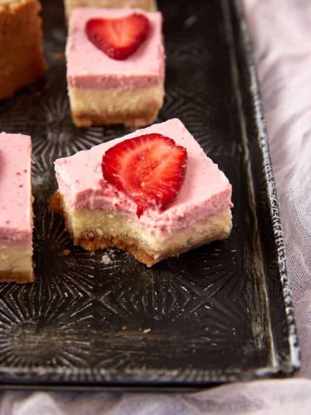 A strawberry bar with a bite taken out.