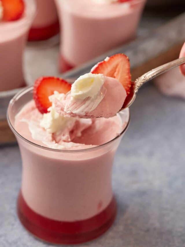 A spoon full of strawberry mousse.
