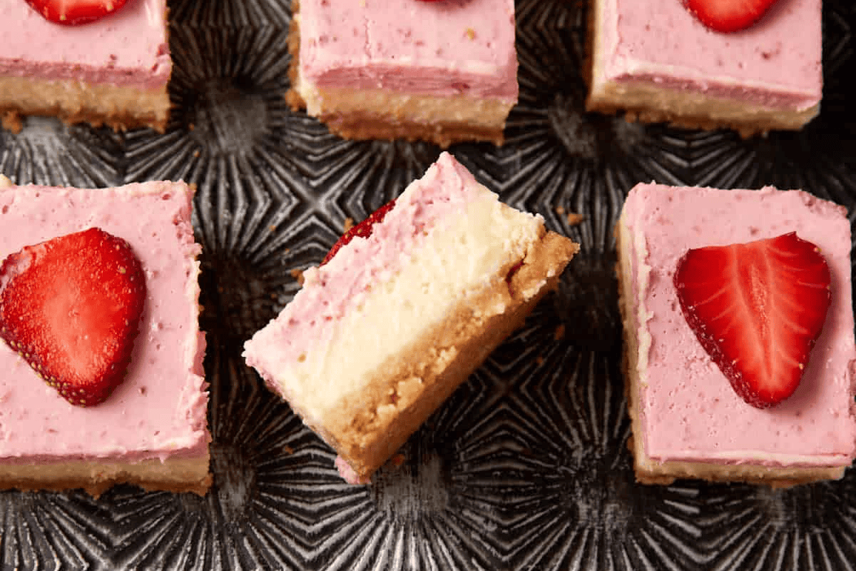 A strawberry cheesecake bar on its side.