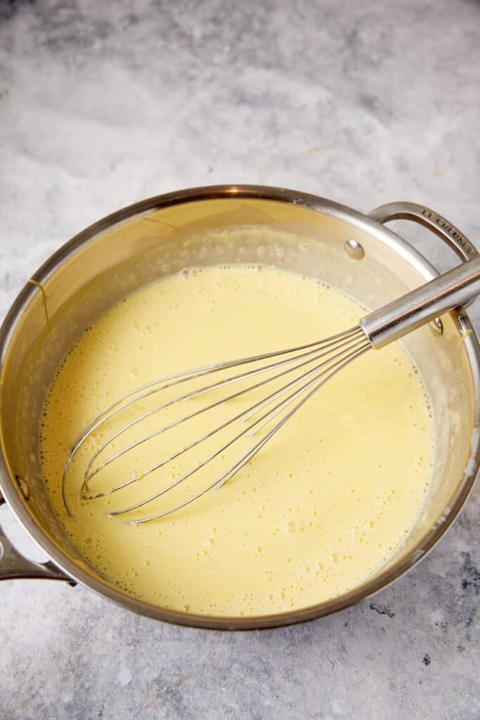 Custard thickened in a saucepan.
