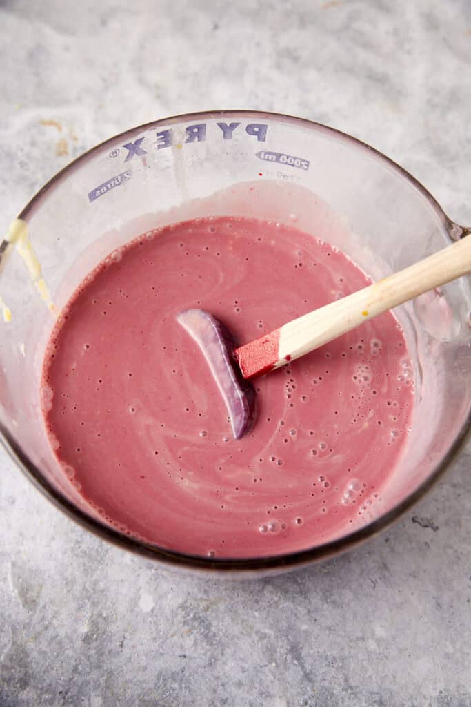 Blackberry syrup added to custard.