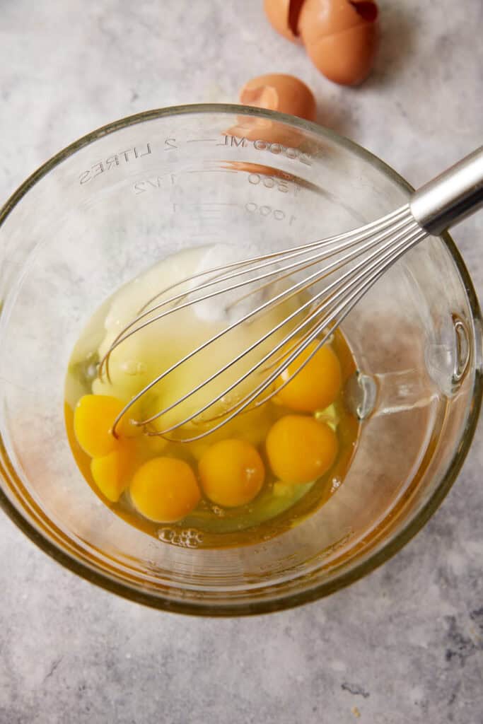 Eggs and sugar in a bowl.