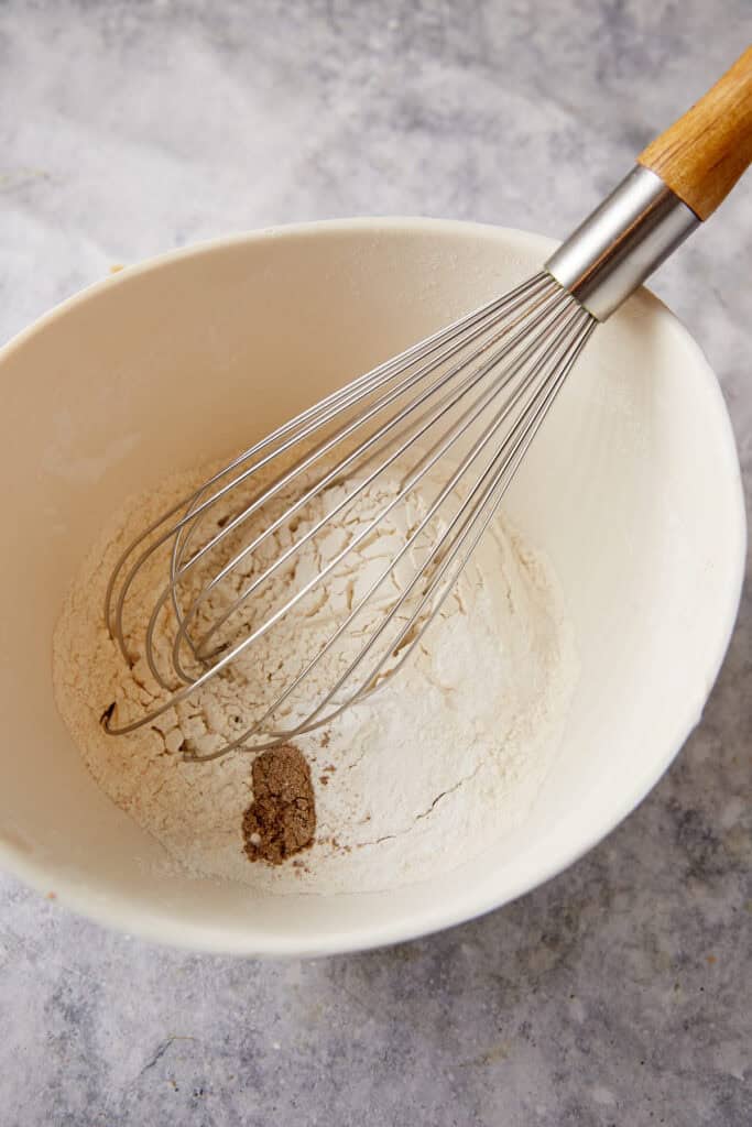 The dry ingredients in a bowl with a whisk