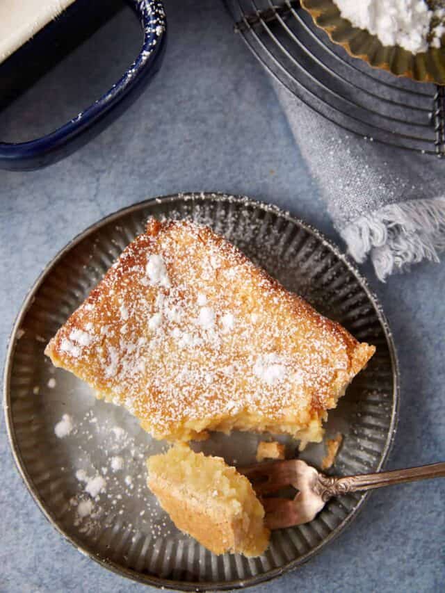 A serving fofbutter case with a bite taken off with a fork.