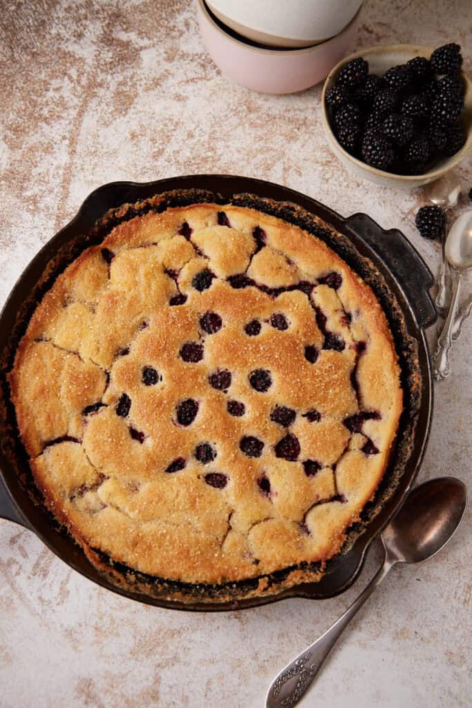 Blackberry cobbler baked in an iron skillet.