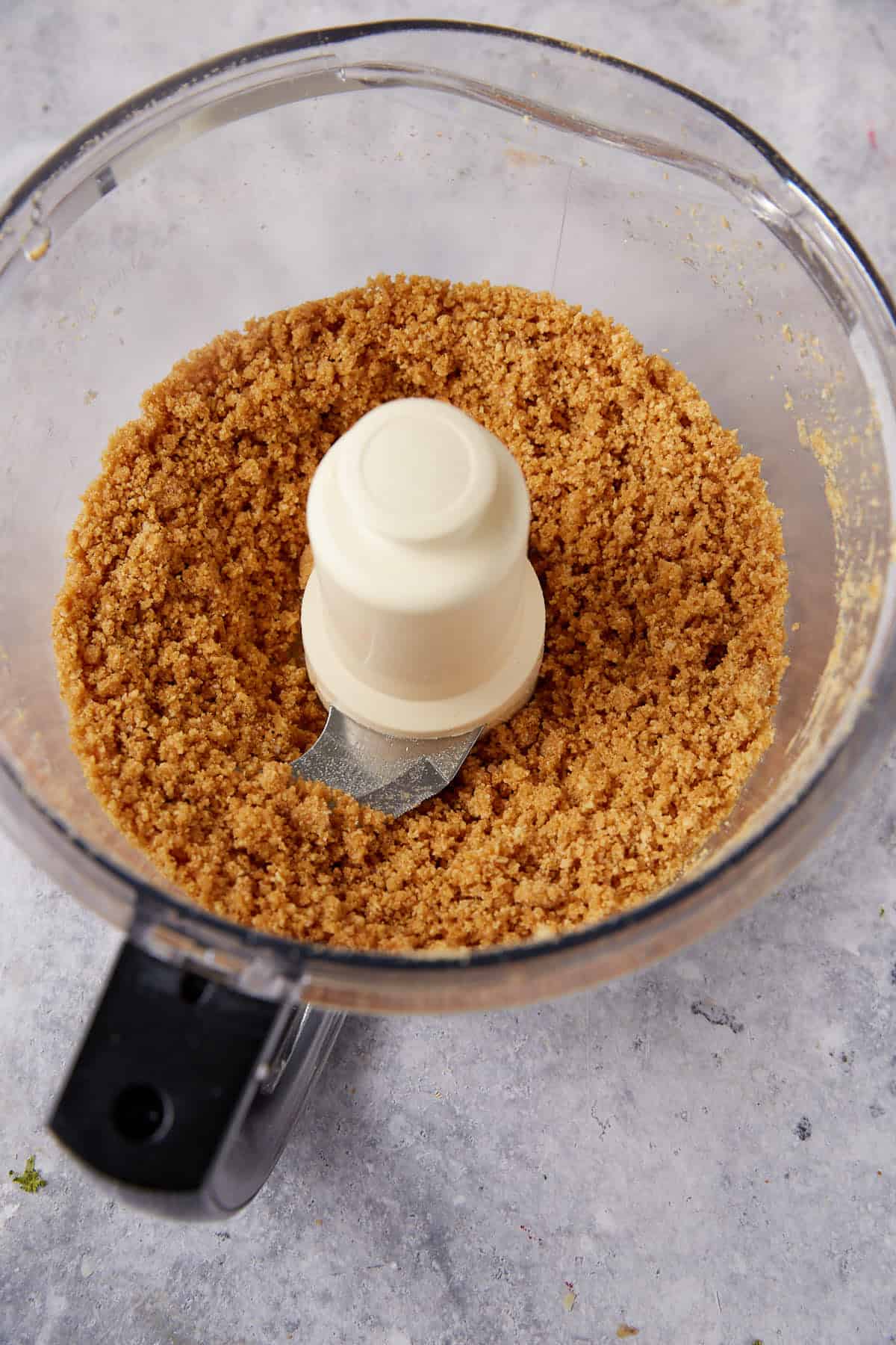 A graham cracker crust in a food processor.
