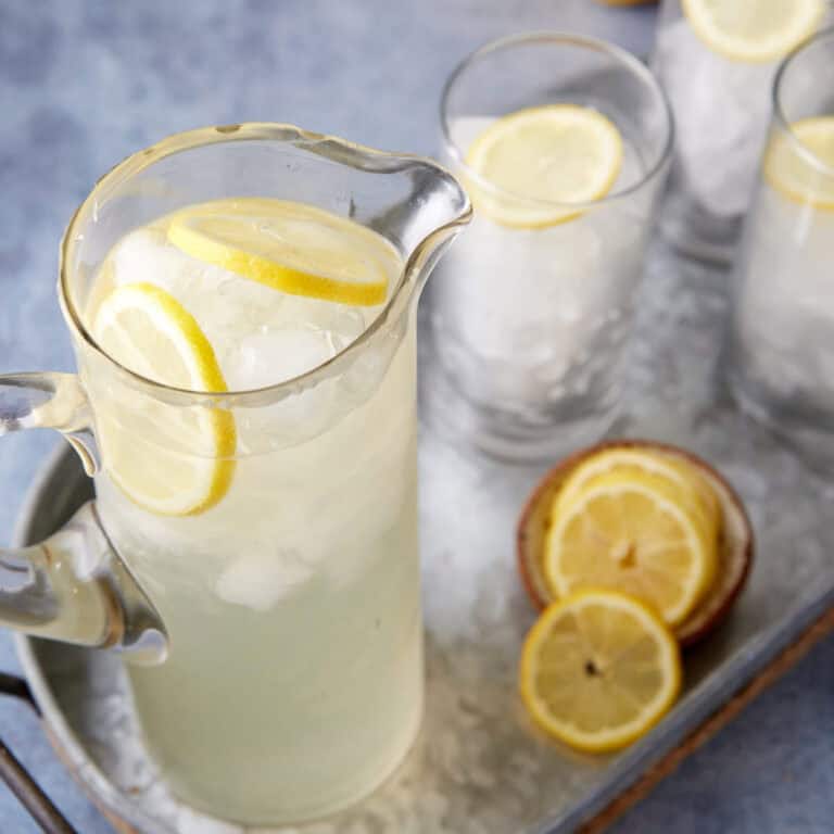 A pitcher of lemonade made with simple syrup.
