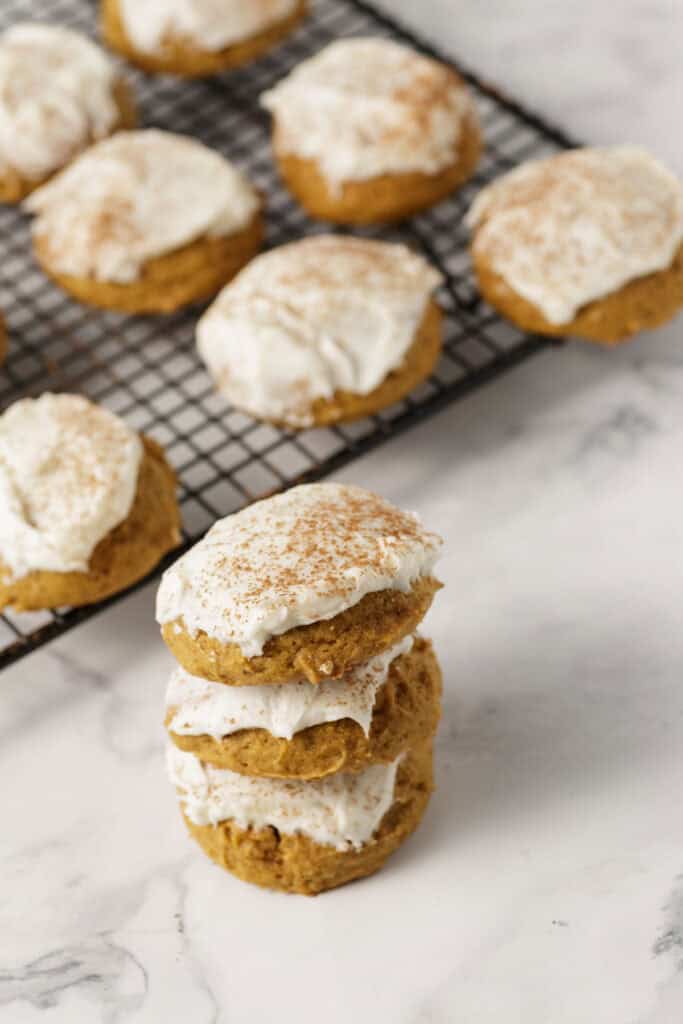 A stack of three pumpkin cookies.