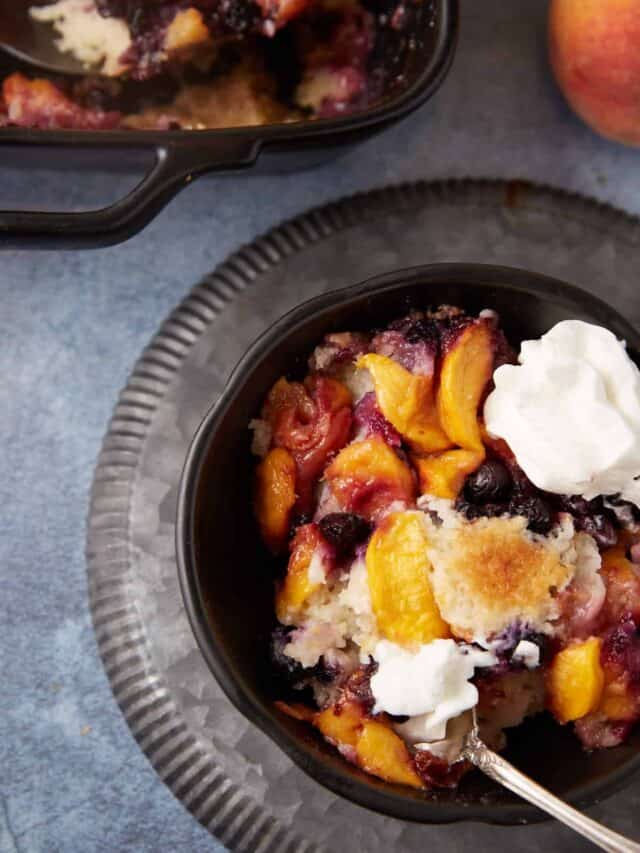 peach cobbler cake in a bowl.