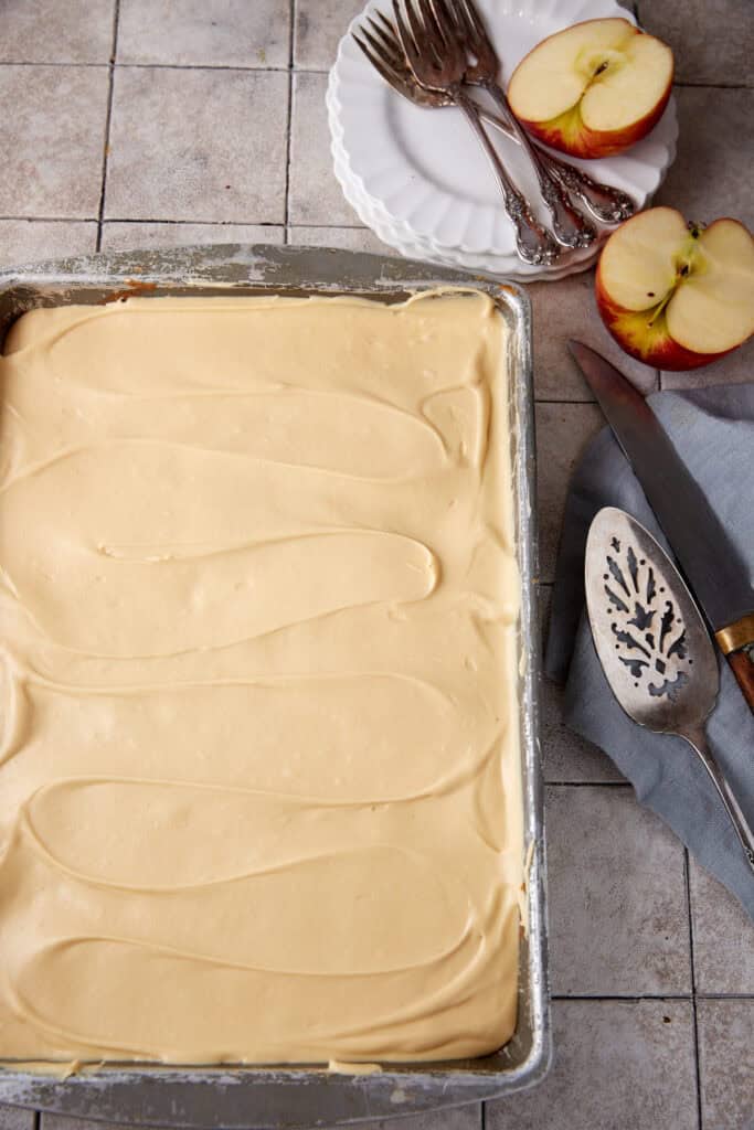 A frosted apple sheet cake before it has been cut.