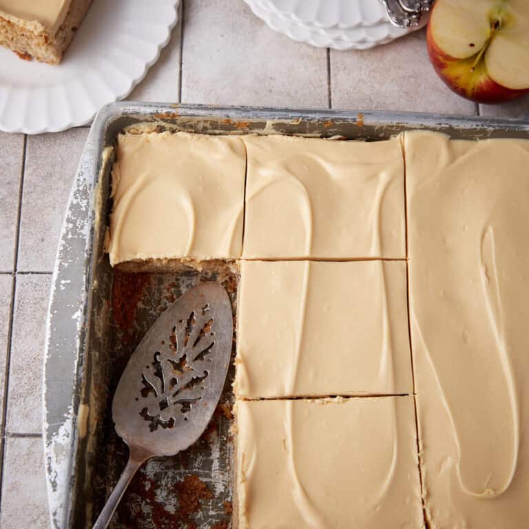 An apple sheet cake cut in a pan.