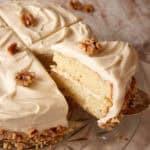 A slice of cake being removed from a banana cake.