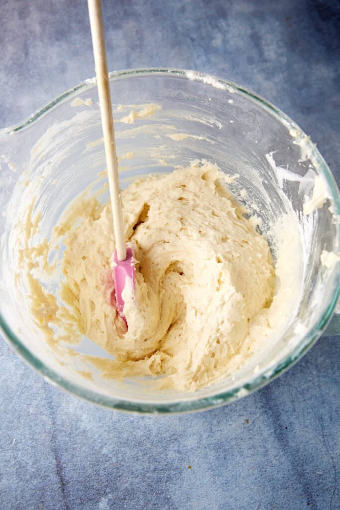 Banana Cake batter in a bowl with a spatula.