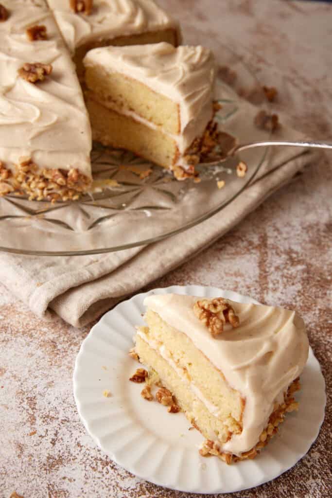 A slice of banana cake on a dessert plate. 