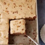 A cake topped with caramel frosting.