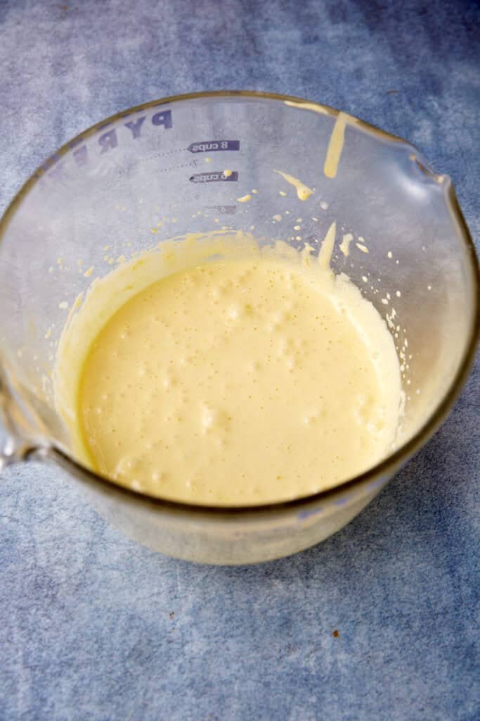 An egg mixture in a measuring cup.