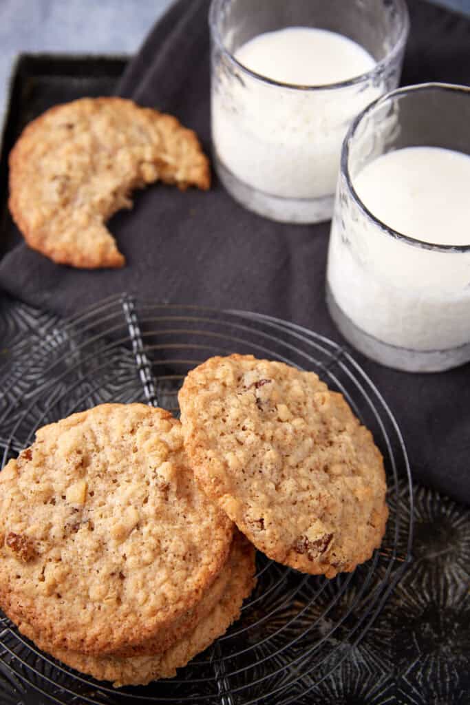 Oatmeal cookies with a bite taken out.