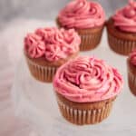 Strawberry cupcakes with cream cheese frosting.
