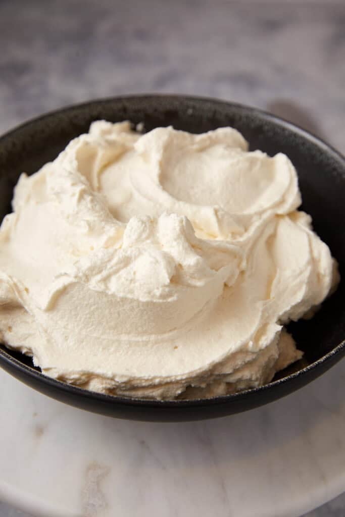 A bowl of cream cheese frosting.