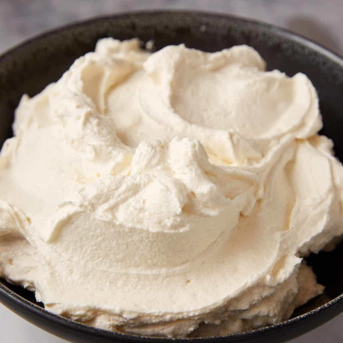 A bowl of cream cheese frosting.