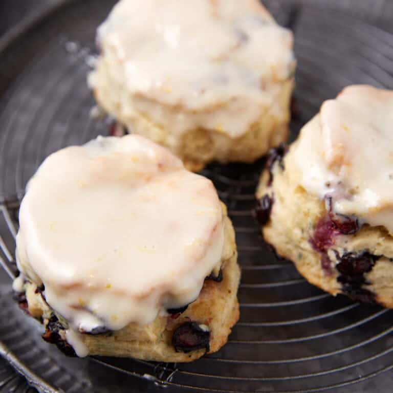 Lemon glazed biscuits on a rack.