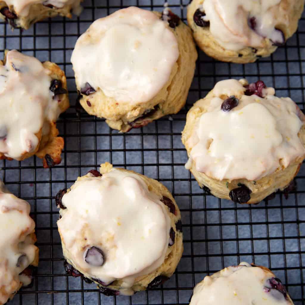 Blueberry biscuits on a wire rack.