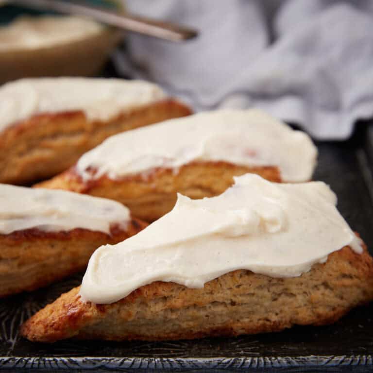 Frosted banana scones on a tray.