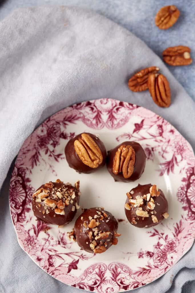 bourbon balls on a dessert plate.