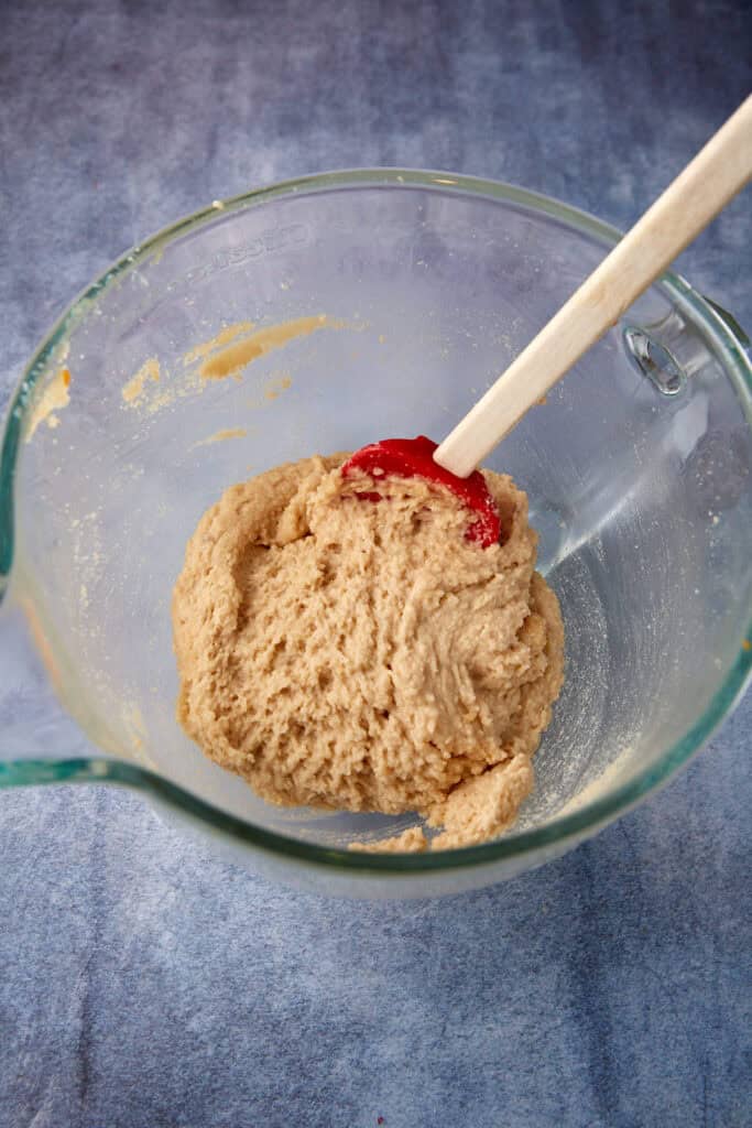 The sugars, butter and oil beaten in a mixing bowl. 