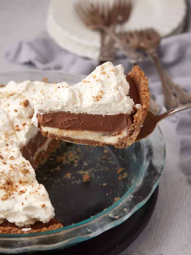 slice of possum pie being lifted out of the pan with a spatula.