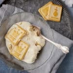bowl of banana pudding with chessmen cookies on top.