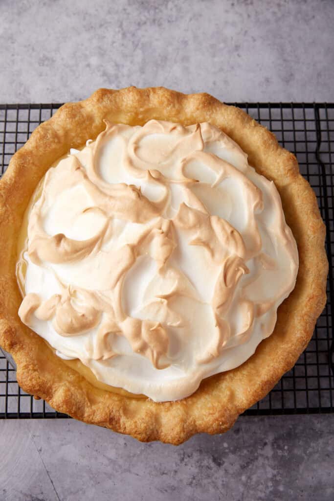 baked butterscotch pie cooling on a wire rack.