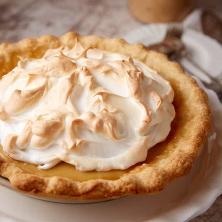 butterscotch pie on a white plate.