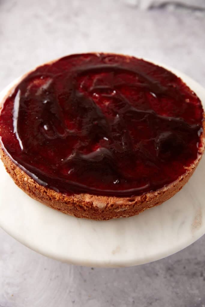 blackberry jam spread onto the bottom layer of blackberry jam cake.