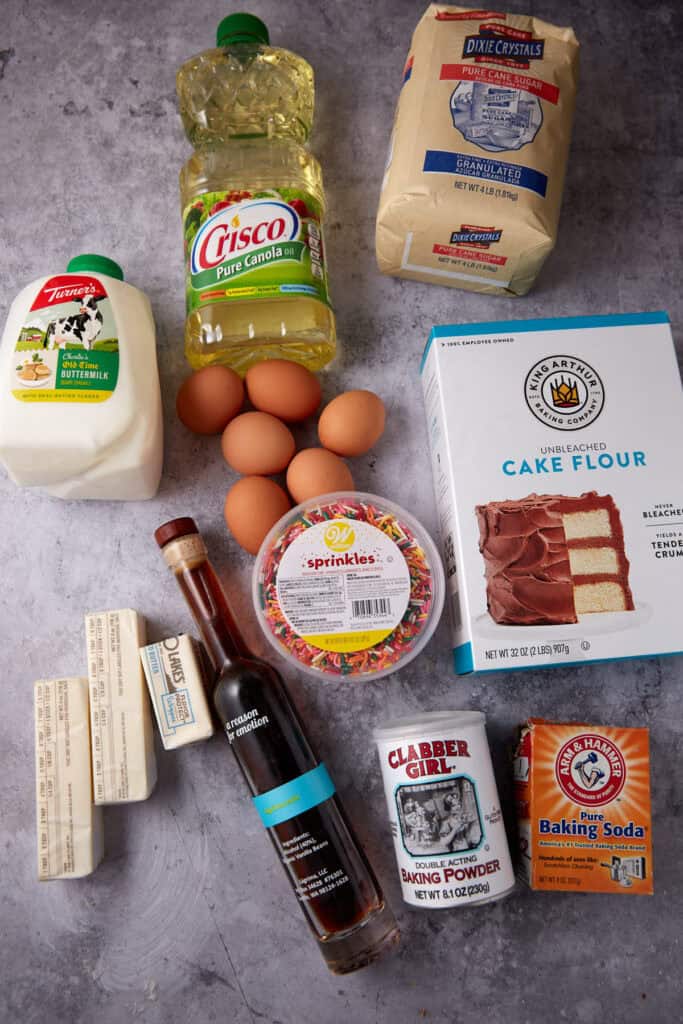 confetti cake ingredients on a gray background.