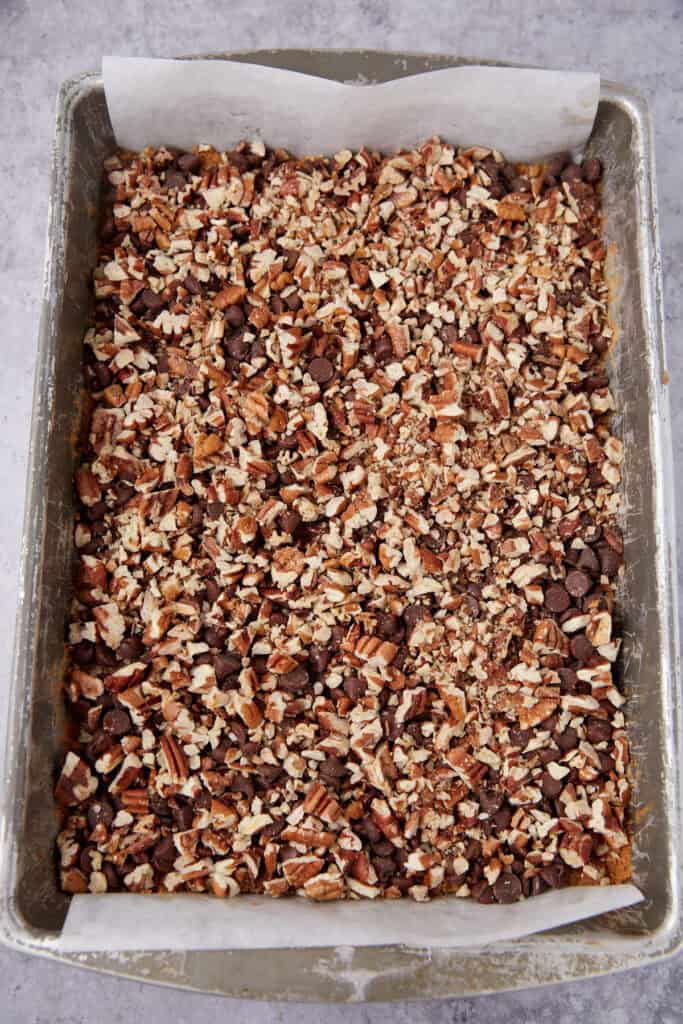 hello dolly bars without condensed milk in a baking pan.